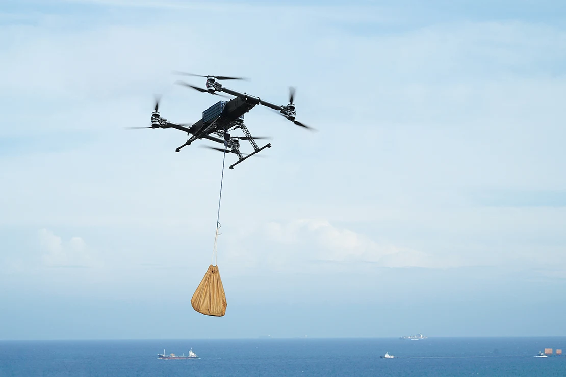KEEL PRO carrying a suspended cargo load over the sea